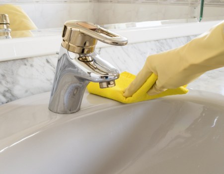 Worker following safety controls during carpet cleaning operations